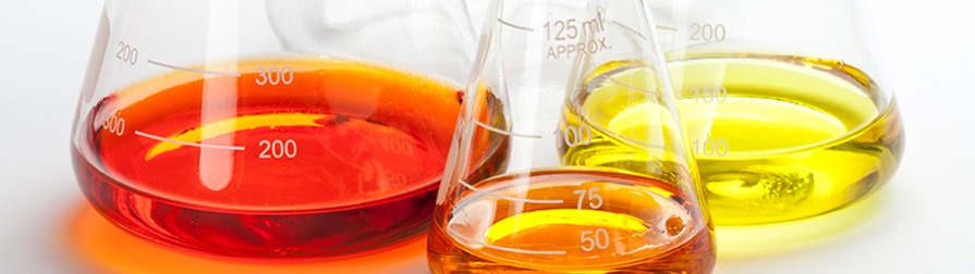Toxicology Division 3 different beaker sizes with colored liquid in each beaker