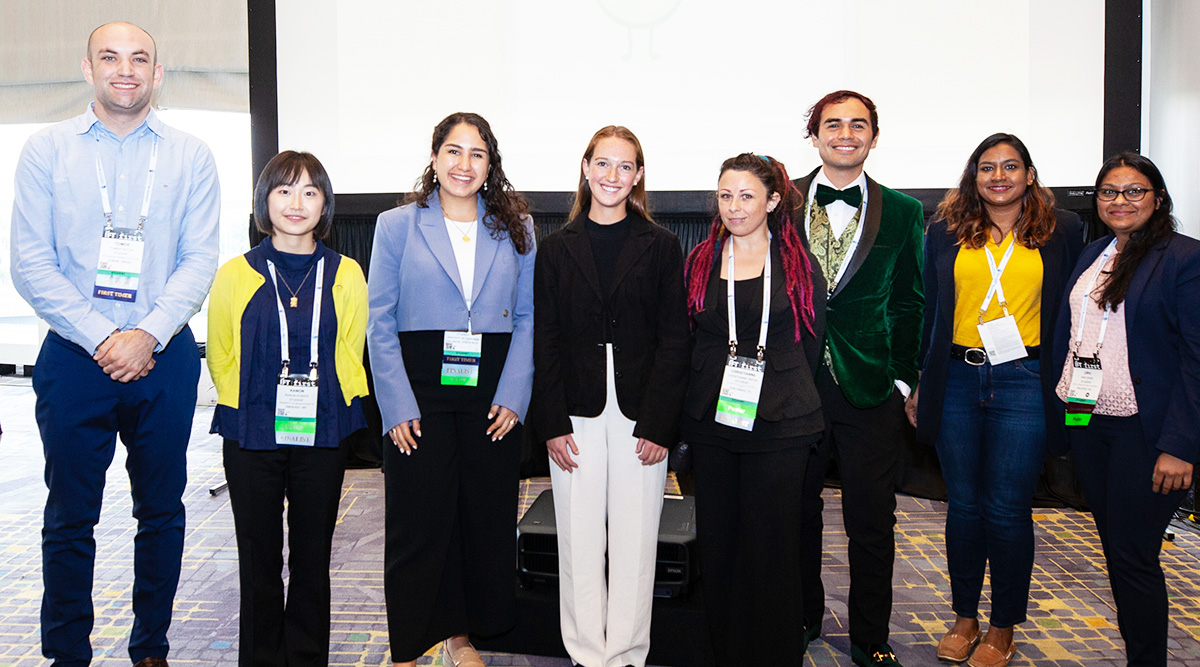 Undergraduate students lined up with event passes