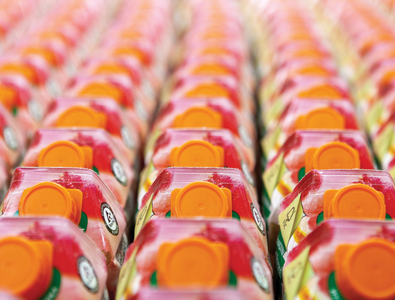 Fruit juices on store shelves in supermarket