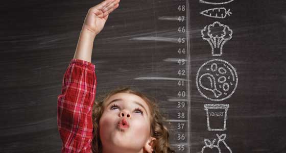 Child measuring growth