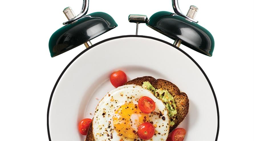 Alarm clock and breakfast meal.