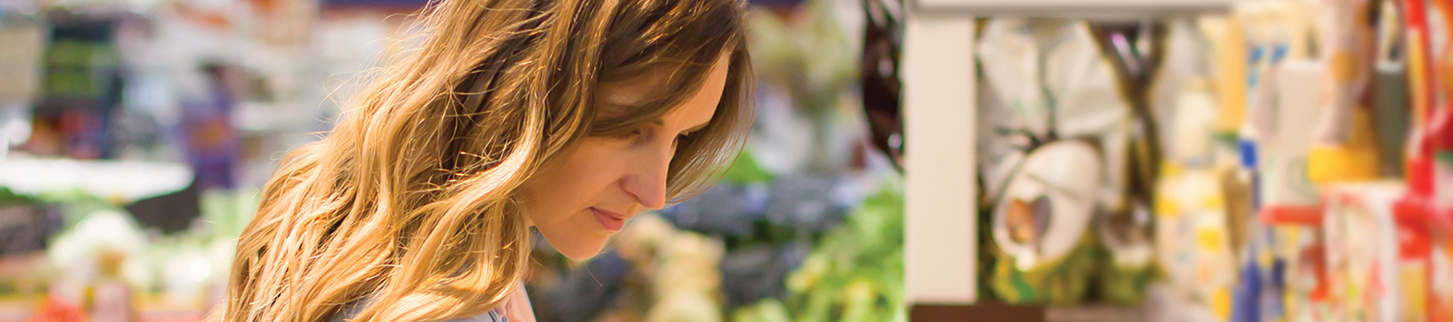 Woman in grocery store natural foods area