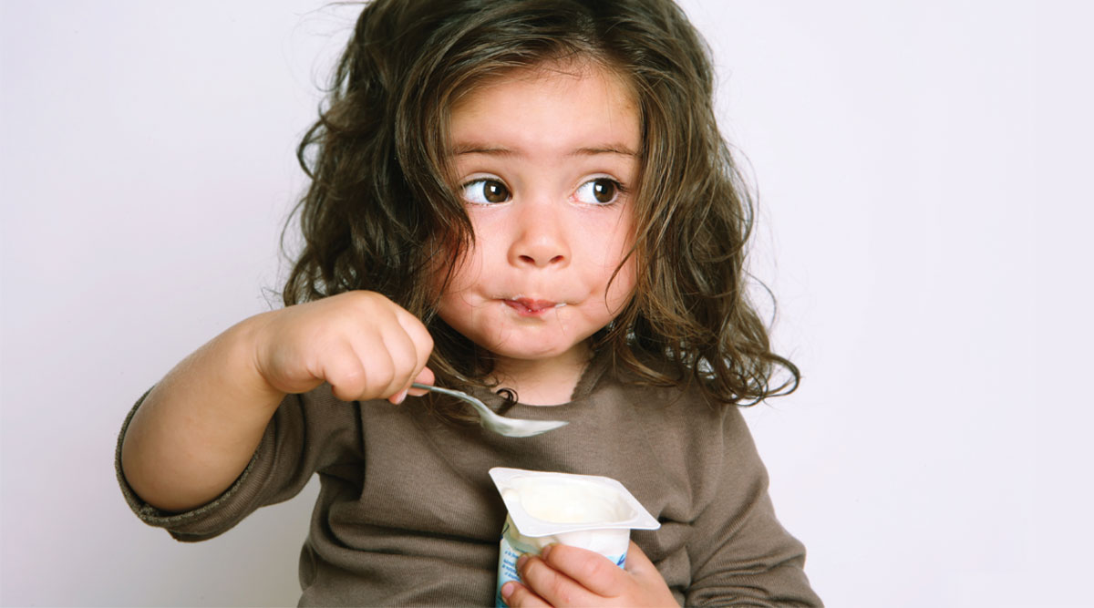 girl eating yogurt
