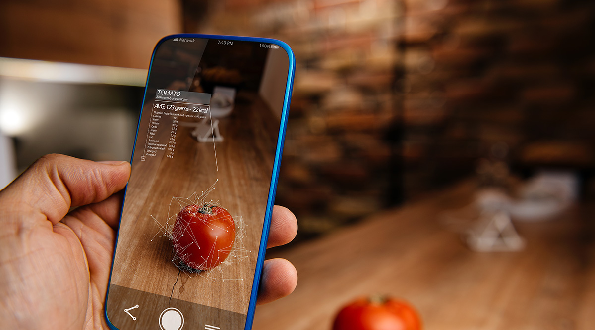 Omnivore Episode 23 person scanning a tomato with a smartphone analyzing it's nutrient breakdown