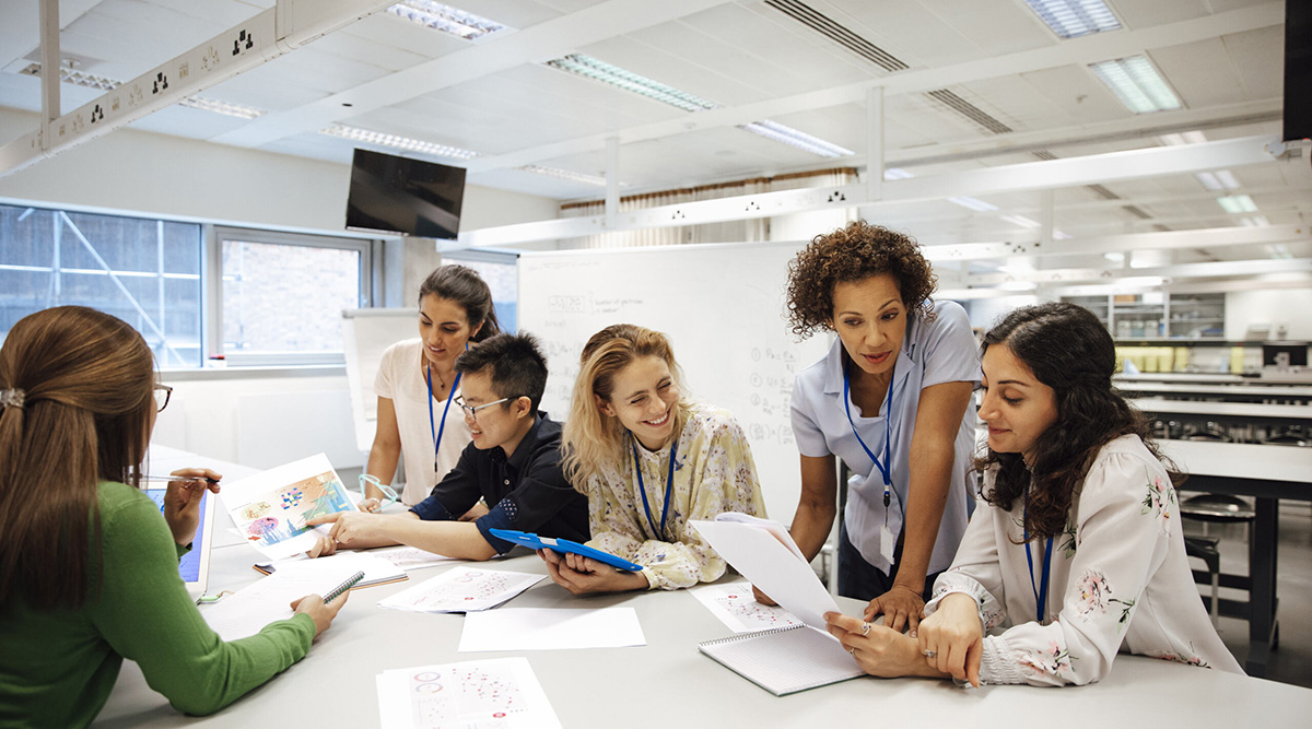 Coworkers at a table working on a project.